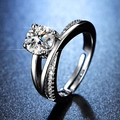Macro shot of a classic six-prong moissanite ring with a diamond-set crossover band - Y113 Crisscross Pave Solitaire