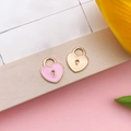 Pink enamel heart padlock charm and golden striped metal pendant on beige paper - 11x13mm-0.5g / Pink Enamel Heart Lock