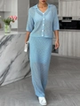 Detail of light blue knit two-piece set featuring short sleeve cardigan and high waist maxi skirt - S / Lake Blue
