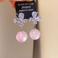 Detailed macro of 925 silver butterfly earrings with sparkling crystals and pink pearls - Silver-Multicolor (12# Silver Pin)