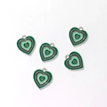 Detailed view of heart-shaped alloy charms with green and grey enamel concentric patterns - Gold Tone Colorful Multilayer Heart