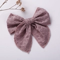 Close-up of embroidered lotus pink cotton bow hair clip with delicate leaf pattern detail - Purple