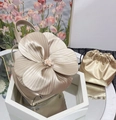 Macro detail of champagne gold floral tote bag with pearl center and matching drawstring pouch - Champagne