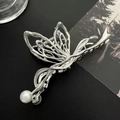 Silver hollow butterfly hair claw clip with white pearl accents on black background - Hollow Butterfly Wing Pearl Style / Large / Silver