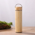 Insulated bamboo water bottle with a metal carry loop on a natural wood surface - 500ml Cup with Steel Handle and Bamboo Lid