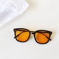 Square black frame sunglasses with transparent orange lenses and silver rivet details - Black Frame Orange