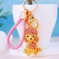 Exquisite golden poodle keychain with pink rhinestones and a woven leather strap charm - Pink Rope + Poodle Pink