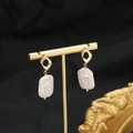 Elegant baroque square pearl earrings with golden geometric stud on a luxury stand - Hollow Rhombus Baroque Studs / White Irregular Hollow Rhombus