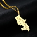 Macro shot of gold Martinique map necklace with detailed geographic engravings on black leather - Gold Engraving Type A