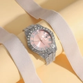 Macro view of full crystal silver watch with pink dial and Roman numeral date display - Silver Strap Pink Dial