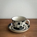 Hand-painted ceramic coffee cup and saucer with black floral and star patterns - 220ml / Black