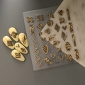 Detail view of leopard print nail stickers with gold foil geometric shapes on beige nails - Geometric Leopard Metal Frame Style (CO-238)