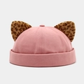 Detail of pink brimless docker cap featuring leopard print cat ears with gold threads - Dusty Pink