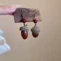 Detail of acorn-shaped drop earrings with purple beads and antique bronze hooks - Coffee Acorn Style (14# Earring Hook)