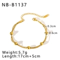 Detail showing 17cm+5cm multilayer gold beaded chain with lobster clasp and weight labels - Gold