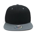 Close-up of black and grey snapback hat featuring a round laser sticker on a flat brim - Dark Gray Brim Black Hat