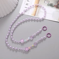Detail of purple and clear floral beads lanyard with metallic clasps on a clean background - Crossbody Chain / Purple