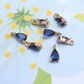 Detail view of 6 royal blue teardrop glass pendants with gold plated copper base for DIY jewelry - 4*8mm / Sapphire Blue