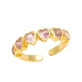 Close-up of heart-shaped pink zircons on gold adjustable ring with polished finish - Adjustable Open / Pink