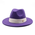 Detailed close-up of dark purple wool fedora with decorative band and gold metal M logo - Purple