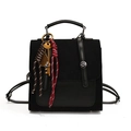 Retro black leather and suede backpack with vintage key and racket charms on white background - With Pendant / Black