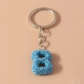 Portachiavi numero 8 azzurro con rose in rilievo e anello in metallo argentato - Lettera B