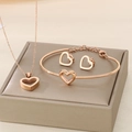 Elegante set di gioielli in oro rosa con collana, bracciale e orecchini a cuore vuoto - Set da 3 pezzi (KS119867-K) / Oro rosa