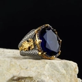 Vintage silver snake ring featuring an oval blue gemstone and gold floral accents - Adjustable Open / Oval Faceted Blue Gemstone