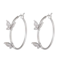 Detail of silver hoop earrings featuring butterfly charms set with sparkling zircons - Butterfly Hoop / Silver