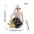 Resin skeleton figurine holding a black rose with dimension and weight labels - Holding Rose Style