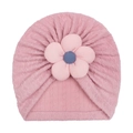 Detailed view of pink knitted baby hat featuring a 3D floral accent and textured cable pattern - Pink