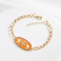 Detail showing 18K gold plated curb chain bracelet with orange enamel Sagittarius pendant - Sagittarius