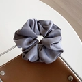 Glossy grey satin scrunchie hair tie with elegant silk-like pleated texture - Gray