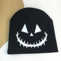 Black knit beanie with white Halloween pumpkin face jacquard for winter outdoor warmth - Pumpkin Expression / Black and White