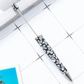 Handmade beaded pen featuring a bold black and white skull and crossbones pattern - Black and White Skull Pattern (2)