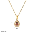 Detail of 14x9mm water drop pendant with red ruby and white zircon in 18K gold finish - Teardrop Halo Style (TN3266)