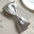 Silver metallic fabric bow hair clip with textured double-layered design for women - Silver
