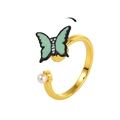 Adjustable gold rotating ring featuring a mint green butterfly and elegant white pearl - Butterfly Pearl