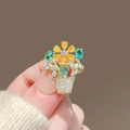 Macro detail of alloy flower pot brooch with colorful crystals on golden metal - 446# Flower Basket