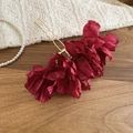 Close-up of three wine red fabric flowers on a gold U-shaped metal hairpin for women - Burgundy