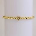 18k gold plated brass beaded elastic bracelet featuring a micro-pave letter S charm - Letter S
