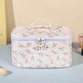 Quilted floral makeup bag with pink flower patterns and star-shaped silver zippers - Medium / White