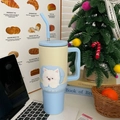 Blue and yellow 1200ml insulated puppy tumbler with ergonomic handle in home office setting - 40oz / Westie