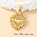 Golden heart pendant with religious sunburst relief, size 31x23mm and 8g weight - Sacred Heart-39