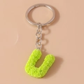Lime green letter U keychain with textured rose pattern and silver metal ring - Letter U