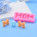 Pink MOM letter silicone mold with resin keychain samples on a blue background - MOM Letter Shape (CX-15) / Pink