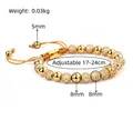 Detail view of gold crown beaded bracelet with adjustable cord and size specifications - Single Style A