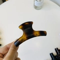 Detailed view of amber tortoise shell hair claw clip with glossy resin finish for women - Medium-8cm / Matte Light Tortoise