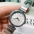 Close-up of elegant silver quartz watch with a white brushed dial and mesh steel strap - Silver