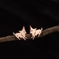 Rose gold puppy stud earrings with detailed dog silhouette on natural branch - Running Puppy (781) / Rose Gold